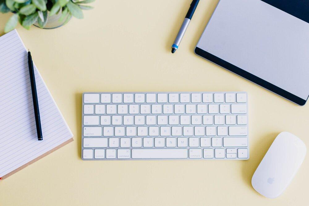 a photo of a desk with a notepad