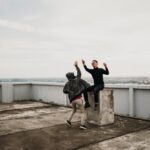 People high fiving on a roof terrace