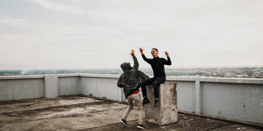 People high fiving on a roof terrace