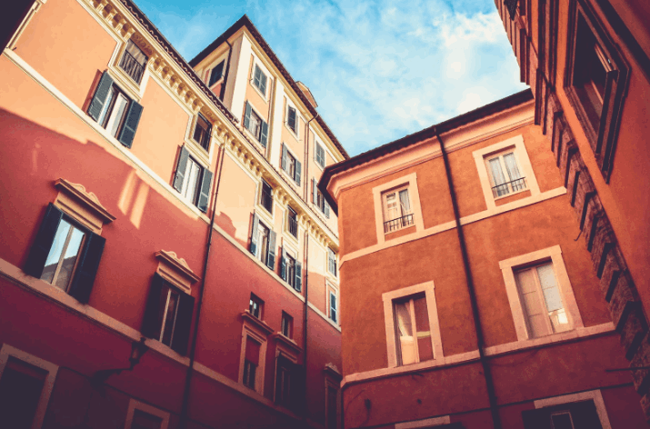 A photo of a spanish-type apartment building